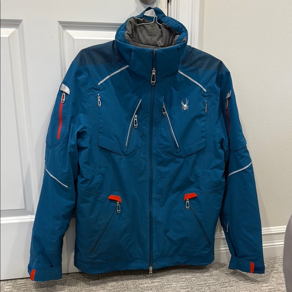 Spyder Blue and Red Ski Jacket with High Collar and Water-Resistant Fabric